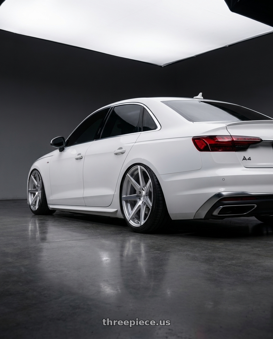 2022 Audi A4 with Rohana RC7 5x112 20x10+33 Machine Silver wheels rear three quarter view slight stretch tires