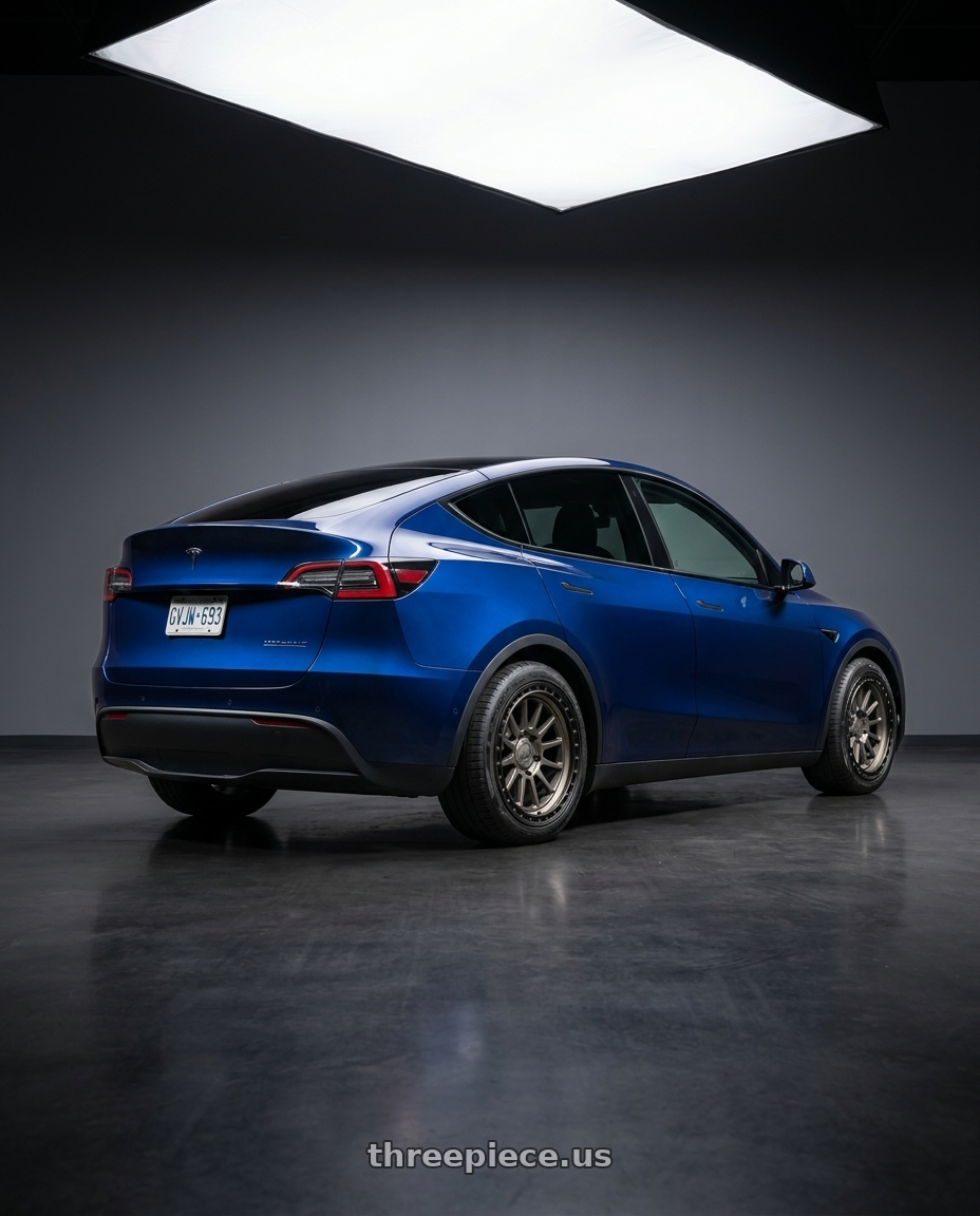 2023 Tesla Model Y with fifteen52 RANGE HD 6x139.7 17x8.5 +0 MAGNESIUM GREY (SATIN BRONZE/SATIN BLACK RING) wheels rear three quarter view square tires