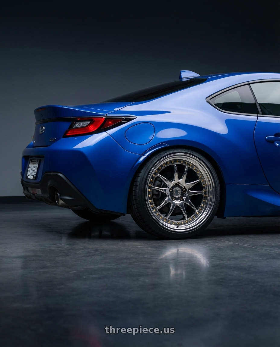 2024 Subaru BRZ with Aodhan DS03 5x114.3 18x9.5 +30 Vacuum Chrome w/Gold Rivets wheels rear three quarter view square tires