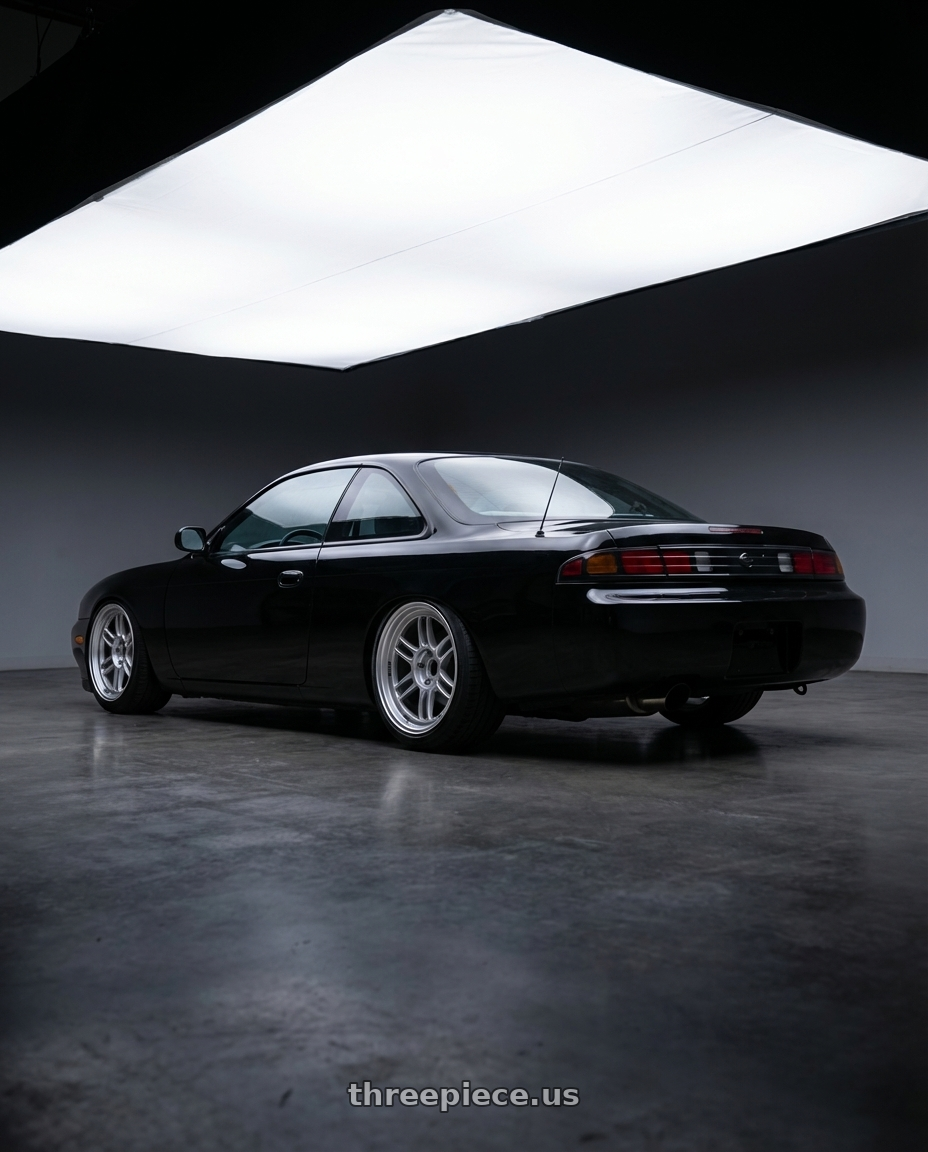1997 Nissan 240sx  with Enkei RPF1RS 5x114.3 18x9.5+12 Silver wheels rear three quarter view square tires