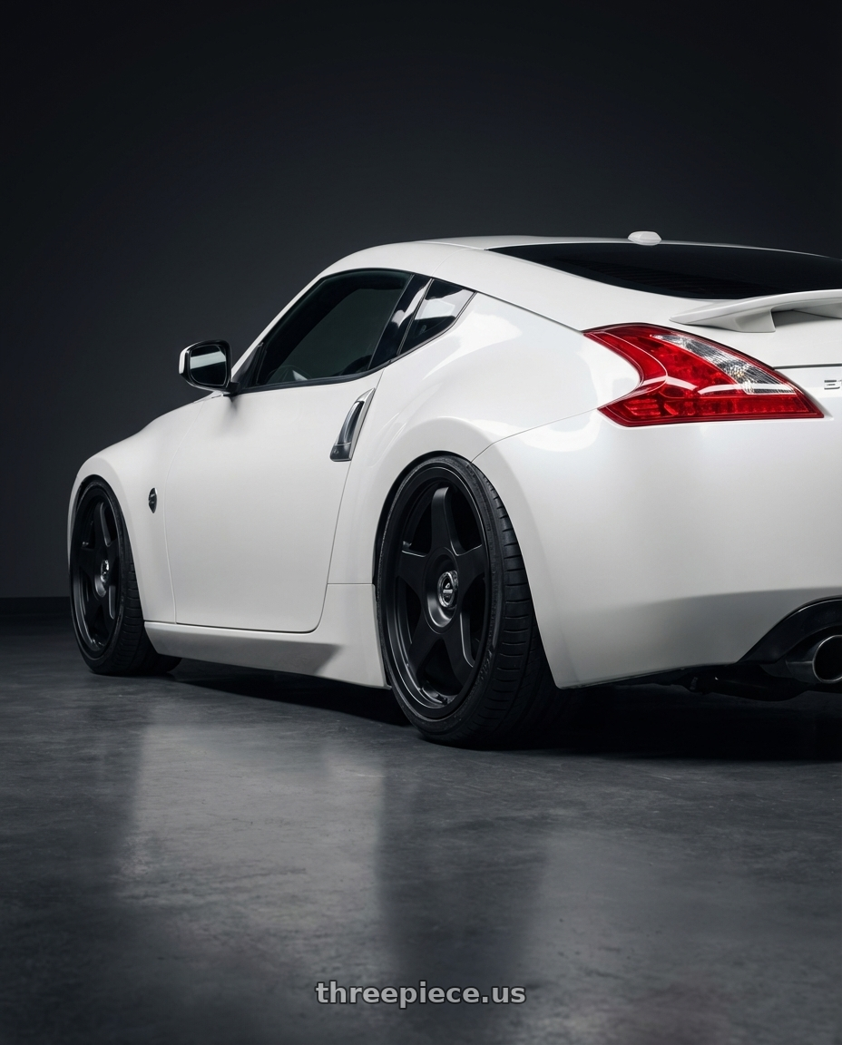 2019 Nissan 370Z with fifteen52 CHICANE 5x114.3 / 5x120 19x8.5 +35 ASPHALT BLACK (SATIN BLACK) wheels rear three quarter view slight stretch tires