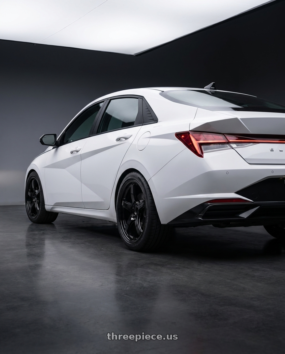 2024 Hyundai Elantra N with Gram Lights 57CR 5x114.3 19x8.5+45 Glossy Black wheels rear three quarter view square tires