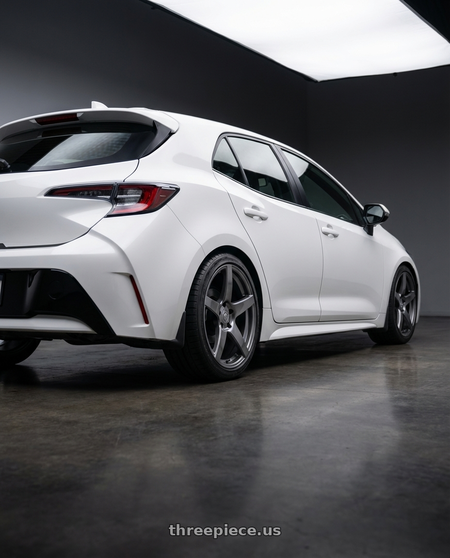 2023 Toyota Corolla Hatchback with Forgestar CF5 5x114.3 18x10 +42 Gloss Anthracite wheels rear three quarter view square tires