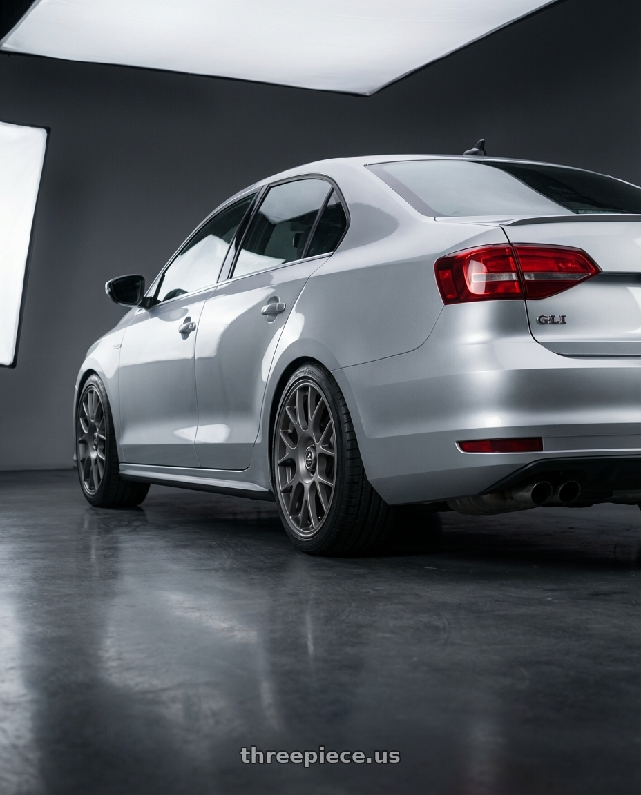 2016 Volkswagen Jetta GLI MK6 with fifteen52 APEX 5x112 / 5x120 18x8.5 +35 FROSTED GRAPHITE (SATIN GREY) wheels rear three quarter view square tires