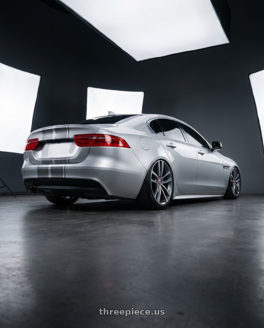 2017 Jaguar Xe 2t with REPLICA WHEELS R5055 5x112 20x9.5+35 GREY / MACHINED wheels rear three quarter view slight stretch tires