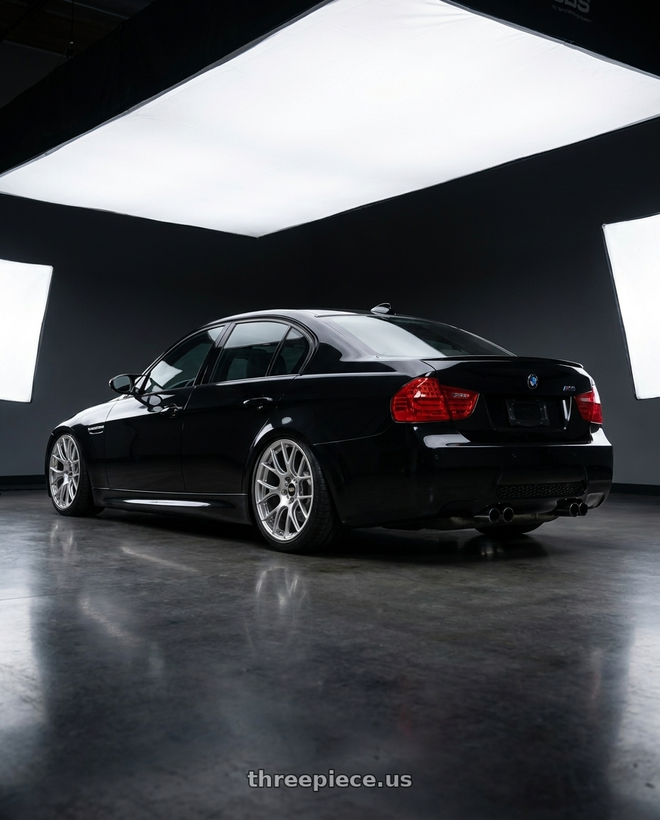 2010 Bmw e90 m3 with BBS RE-V7 5x112 18x8.5 +42 Diamond Silver wheels rear three quarter view slight stretch tires