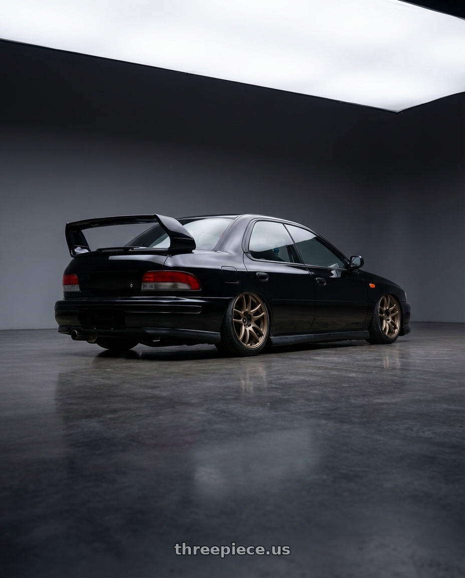 1998 Subaru Impreza GC8 with Work Emotion Cr Kiwami 5x100 17x8 +35 Matte Bronze wheels rear three quarter view slight stretch tires