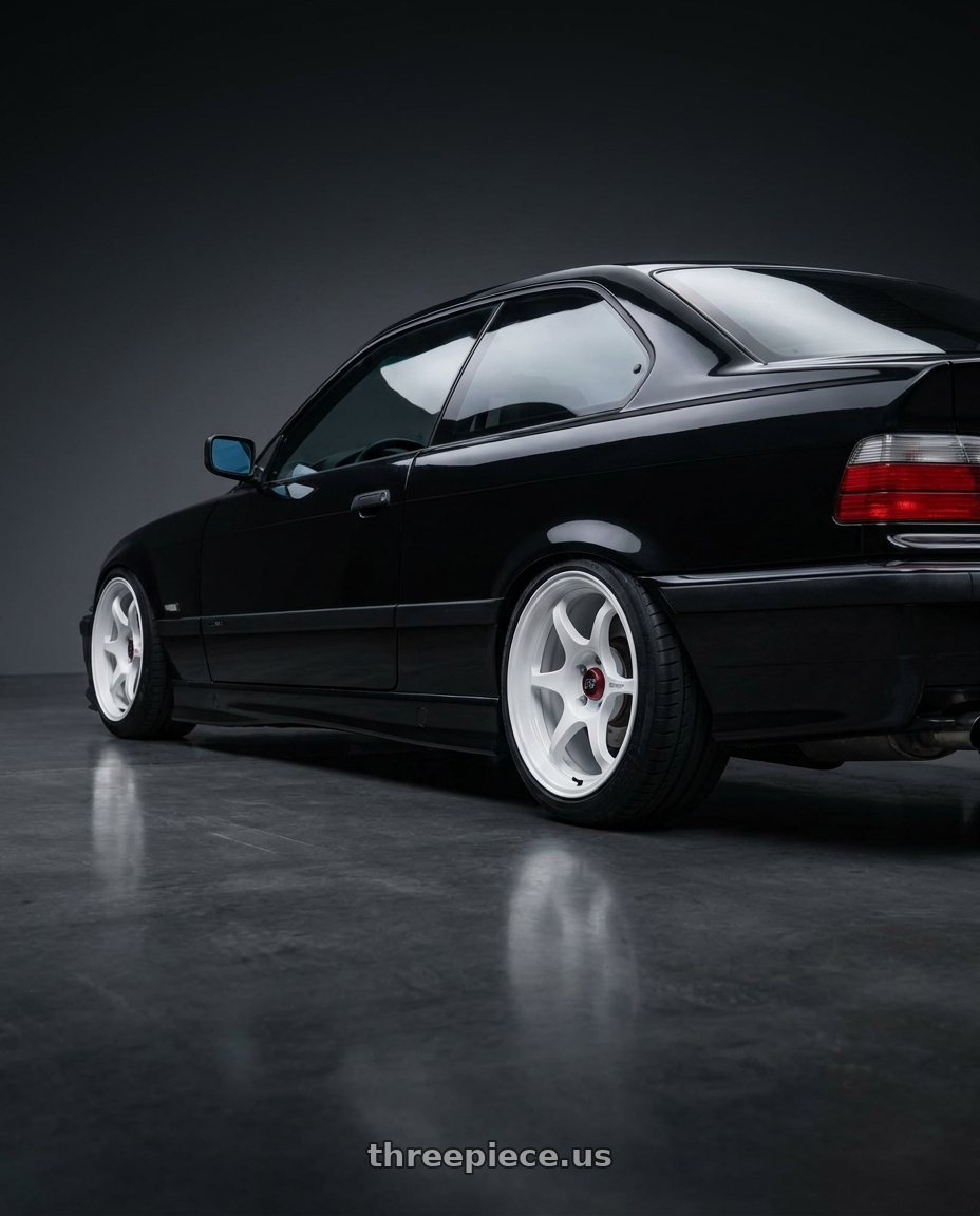 1993 E36 325i coupe with Enkei PF06 5x120 18x8.5+35 White Machined wheels rear three quarter view square tires