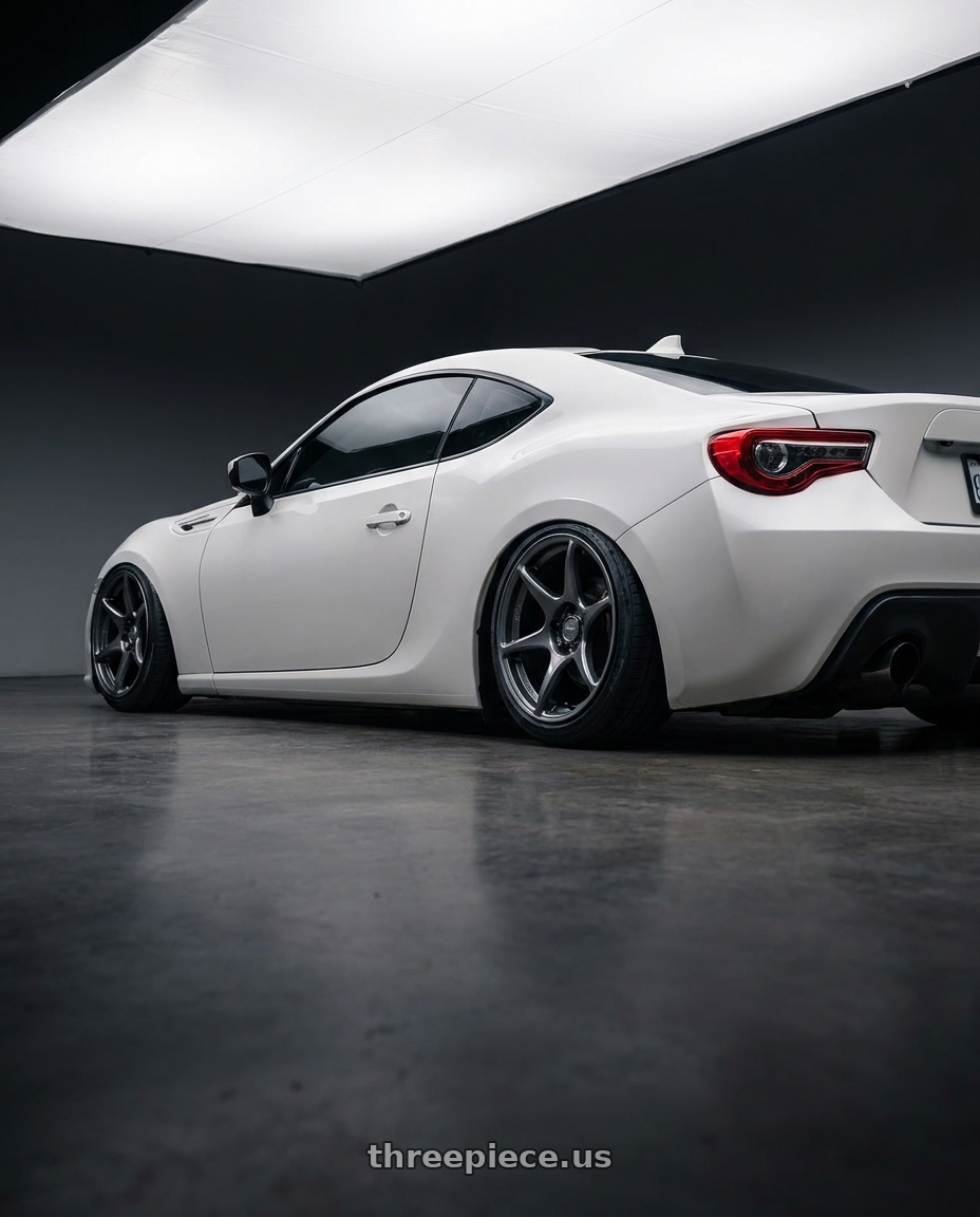 2016 Scion FR-S with Kansei K11G Tandem 5X100 17x9 22 Gunmetal wheels rear three quarter view slight stretch tires