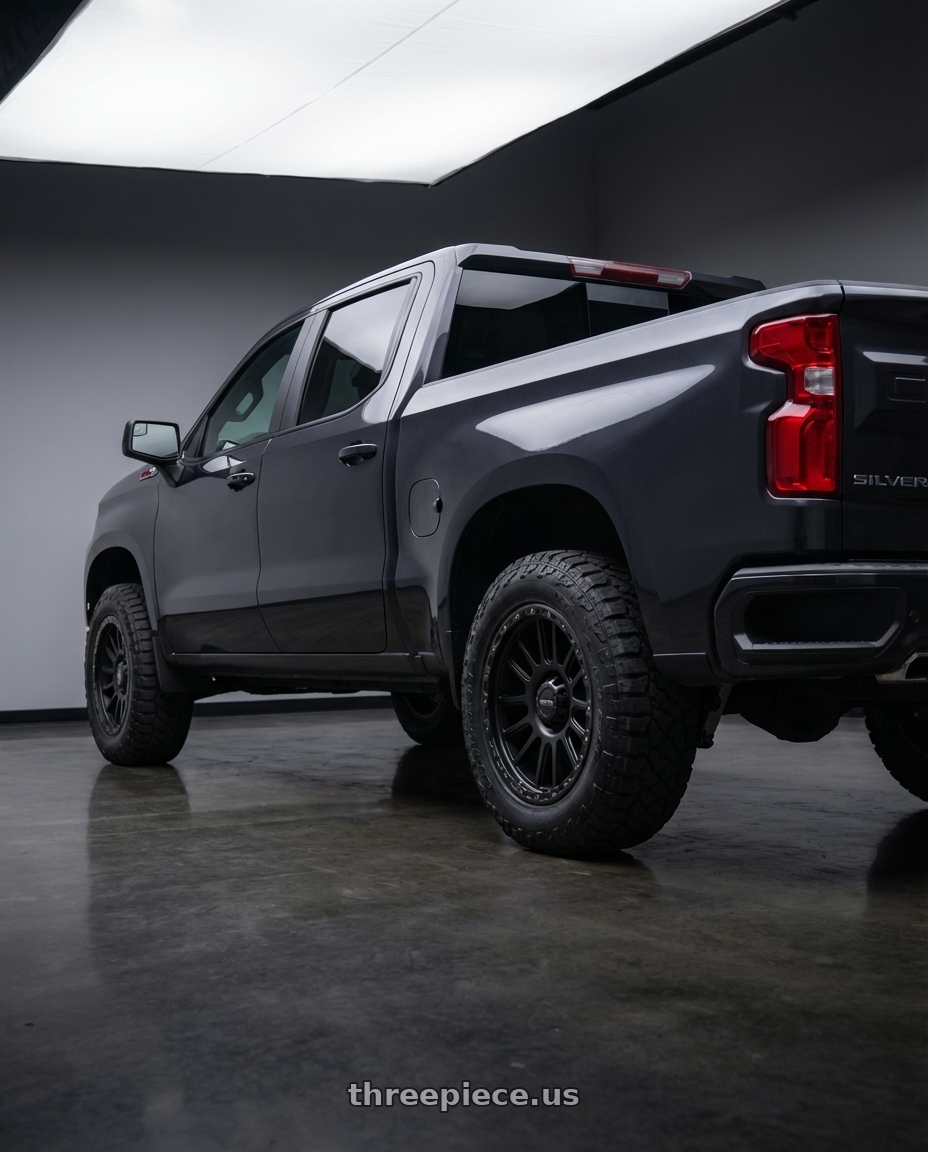 2023 Chevrolet Silverado 1500 with Vision Off-Road 111 Nemesis 6x139.7 20x9+10 Matte Black wheels rear three quarter view meaty tires