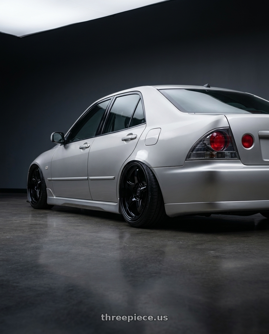 2001 Lexus Is200 with WedsSport RN-05M 5x114.3 19x9.5+28 Gloss Black wheels rear three quarter view slight stretch tires