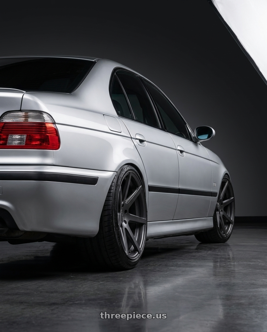 2003 BMW M5 with Rohana RC7 5x120 19x9.5+20 Matte Graphite wheels rear three quarter view slight stretch tires