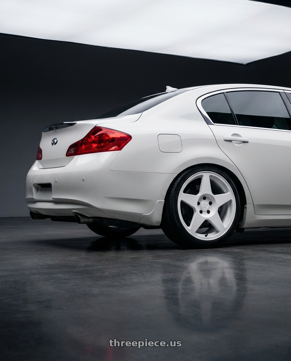 2014 Infiniti G37 Coupe with fifteen52 TARMAC EVO 5x114.3 / 5x120 19x8.5 +35 RALLY WHITE (GLOSS WHITE) wheels rear three quarter view square tires