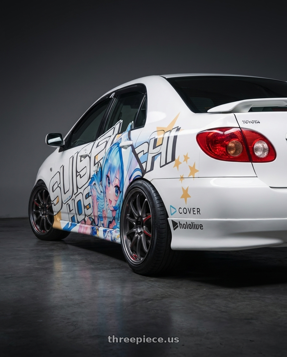 2003 Toyota Corolla with Volk Racing CE28N-PLUS SL 5x100 17x7.5+43 Pressed Graphite wheels rear three quarter view slight stretch tires