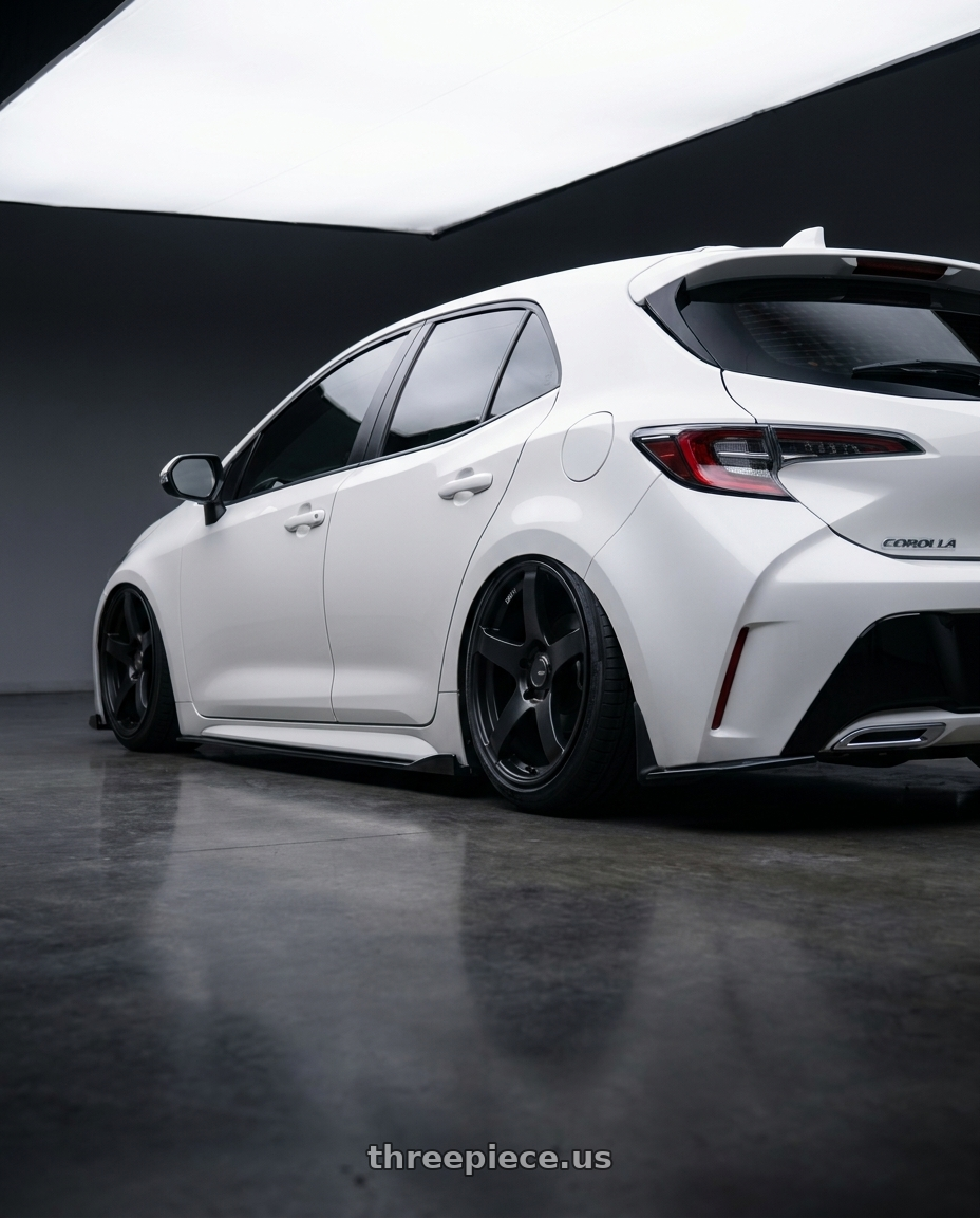 2023 Toyota Corolla Hatchback with Ssr Gtv01 5x114.3 18x9+35  FLAT BLACK wheels rear three quarter view slight stretch tires