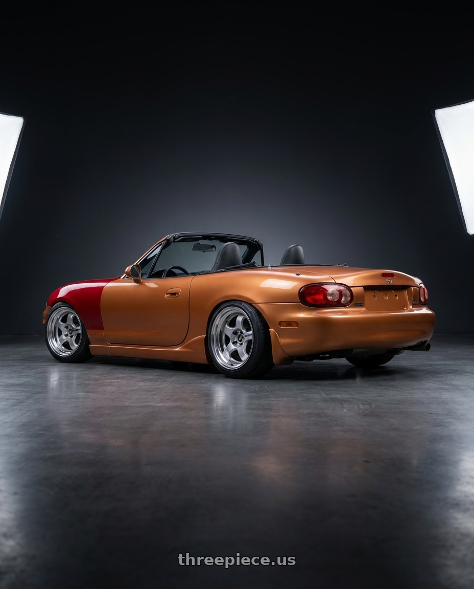 2000 Mazda miata with Work Meister S1 2P 4x100 15x7+38 O Disk Silver wheels rear three quarter view slight stretch tires