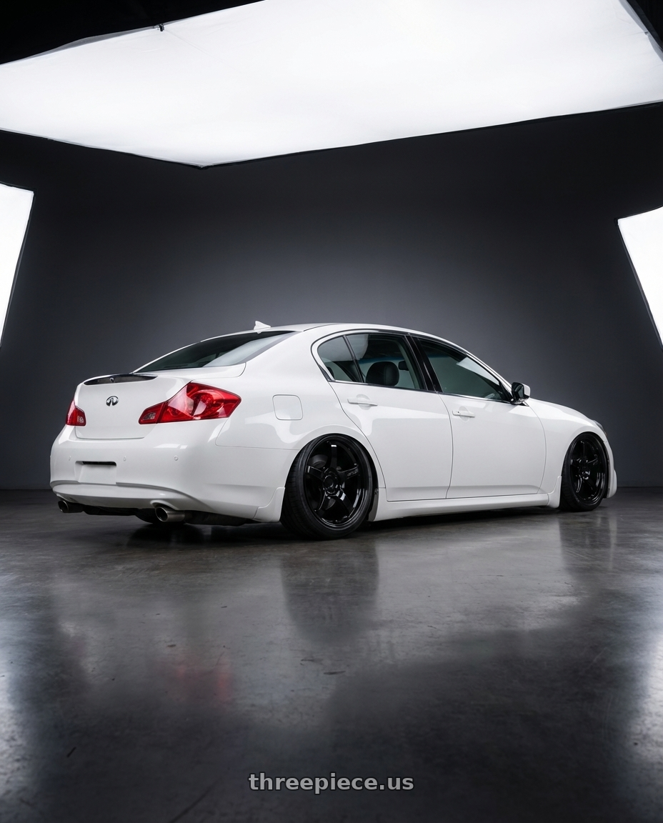 2012 Infiniti G37 with Gram Lights 57CR 5x114.3 19x9.5+35 Glossy Black wheels rear three quarter view slight stretch tires