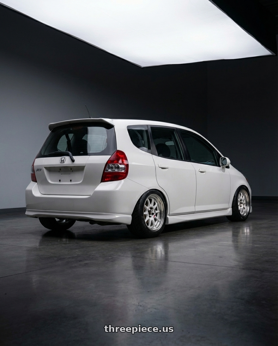 2007 Honda fit  with Work Emotion Rs11 2p 4x100 15x8 30 white wheels rear three quarter view meaty tires