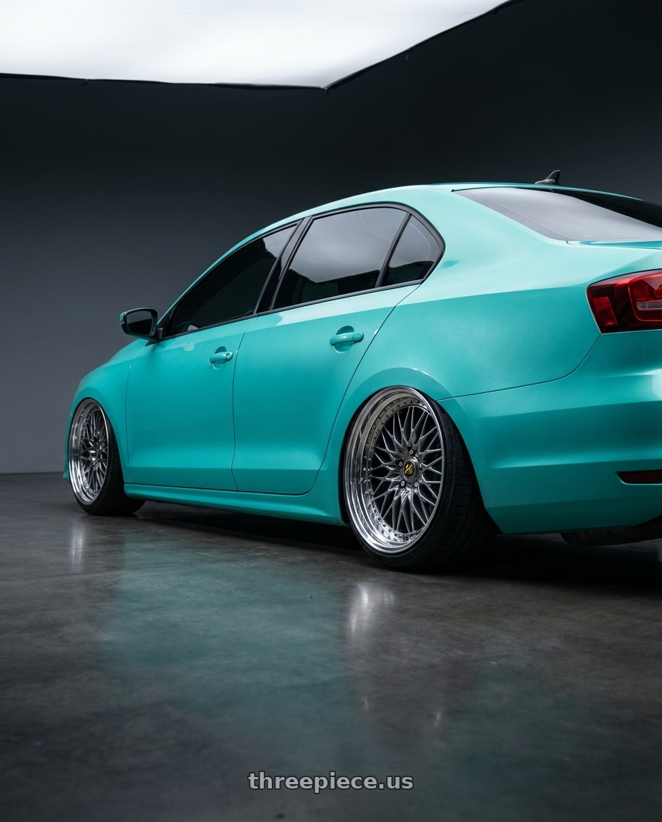 2016 Volkswagen jetta with Work Vs-Xv 5x100 18x11.5+20 A Disk Brilliant Silver Black wheels rear three quarter view slight stretch tires