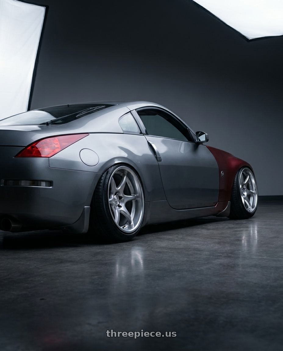 2005 Nissan 350z with Kansei K11S Tandem 5X100 18x9.5 22 Hyper Silver wheels rear three quarter view slight stretch tires