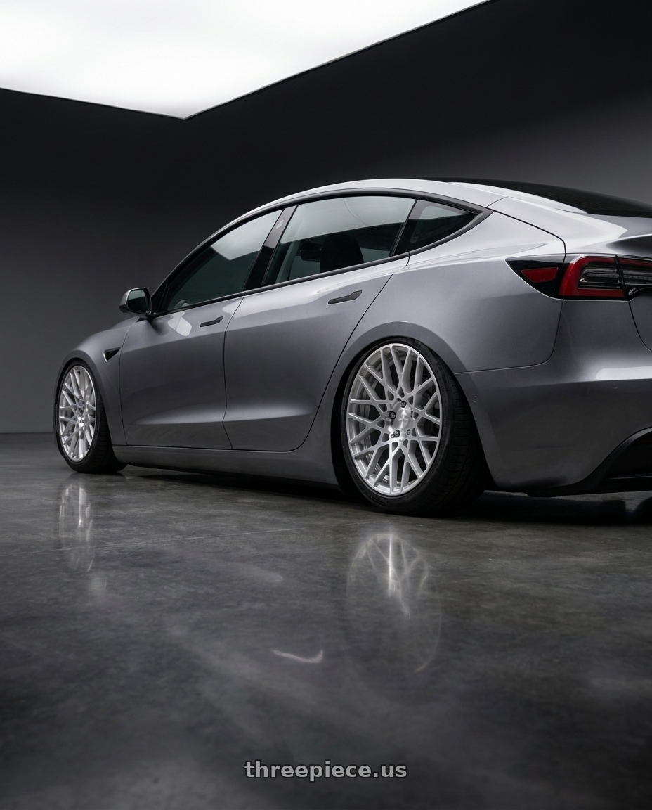 2025 Tesla model 3 with Rotiform 1PC R110 BLQ 5X112 19X8.5 +35 GLOSS SILVER MACHINED wheels rear three quarter view slight stretch tires