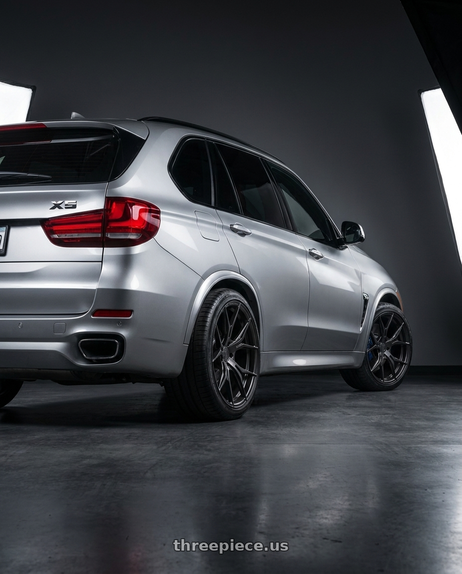 2016 BMW X5 with Rohana RFX5 5x120 20x10+38 Matte Black wheels rear three quarter view square tires