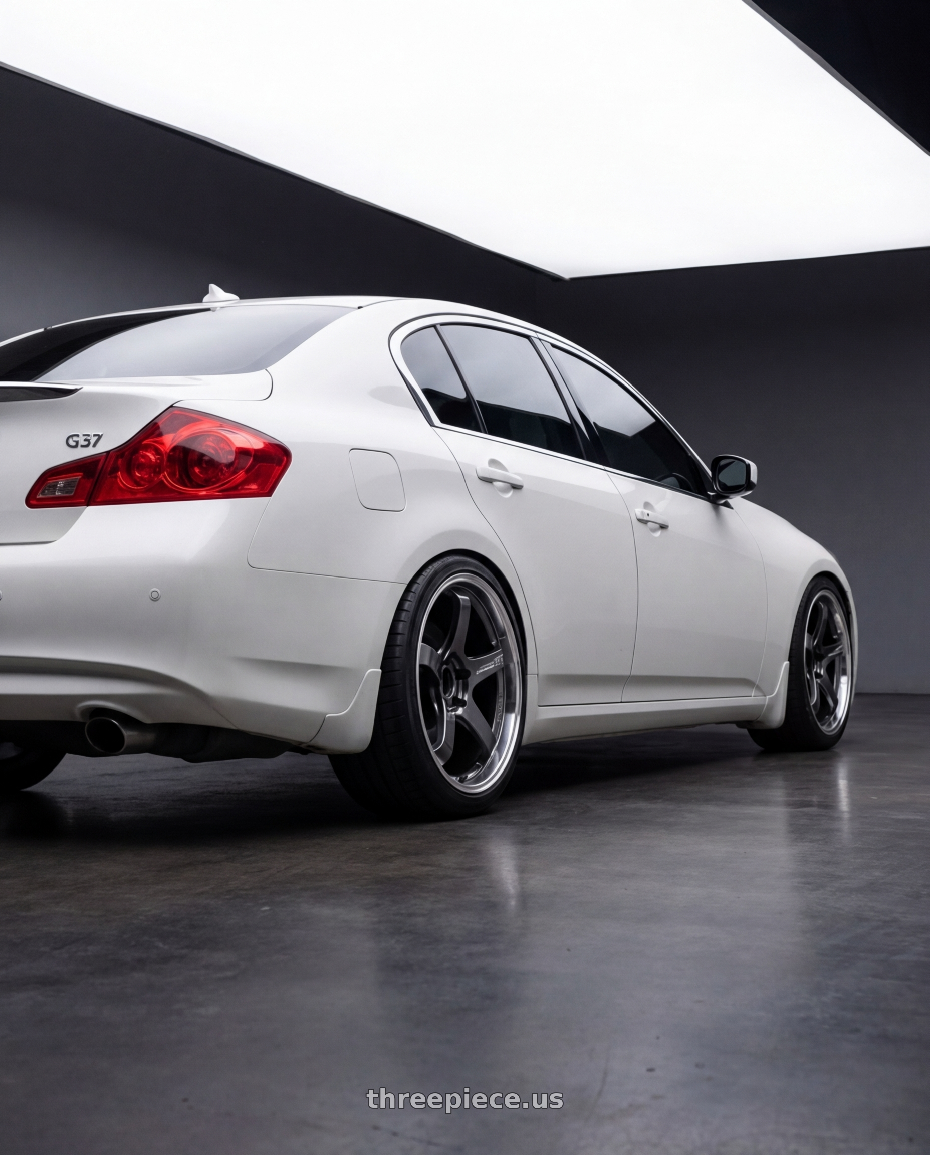 2012 Infiniti G37 with Advan Racing GT BEYOND 5x114.3 19x10.5 +33 RACING TITANIUM BLACK wheels rear three quarter view square tires