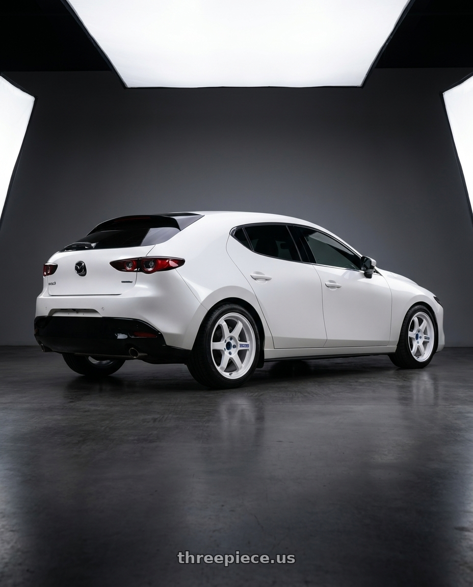 2025 年Mazda 3 with Volk Racing TE37 Gravel 5x114.3 15x7.0+35 White wheels rear three quarter view square tires
