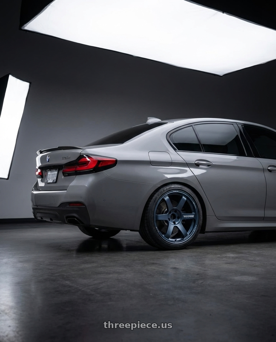 2022 BMW 530i with Volk Racing TE37 SAGA S-PLUS 5x112 19x9.5 +25 MATTE BLUE GUNMETAL wheels rear three quarter view square tires