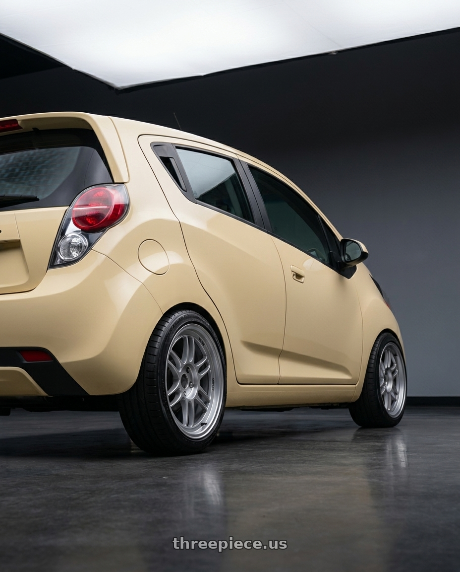 2015 Chevy Spark LT  with Enkei RPF1 4x100 16x8+38 Silver wheels rear three quarter view slight stretch tires