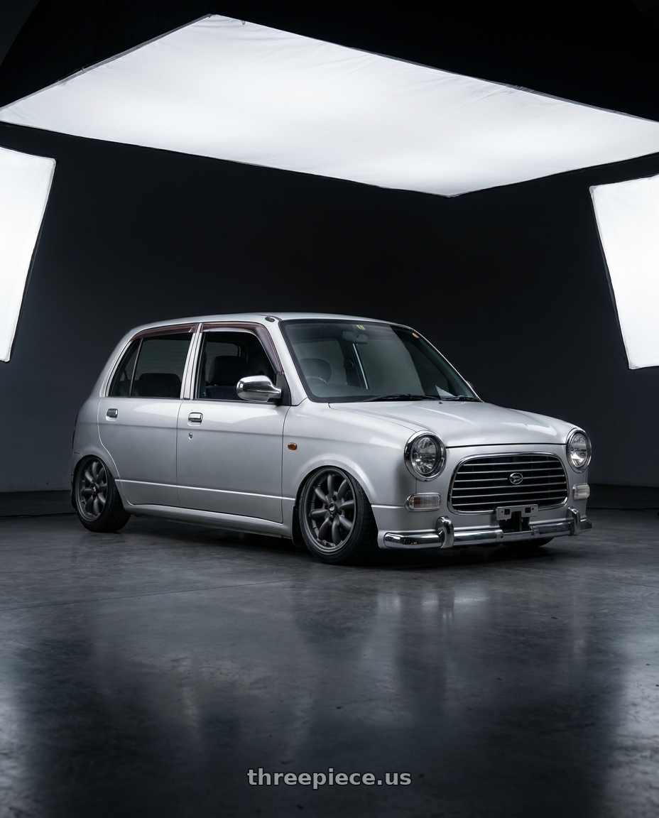 2000 Daihatsu mira gino with Enkei Compe 4x100 15x7+38 Matte Gunmetal wheels