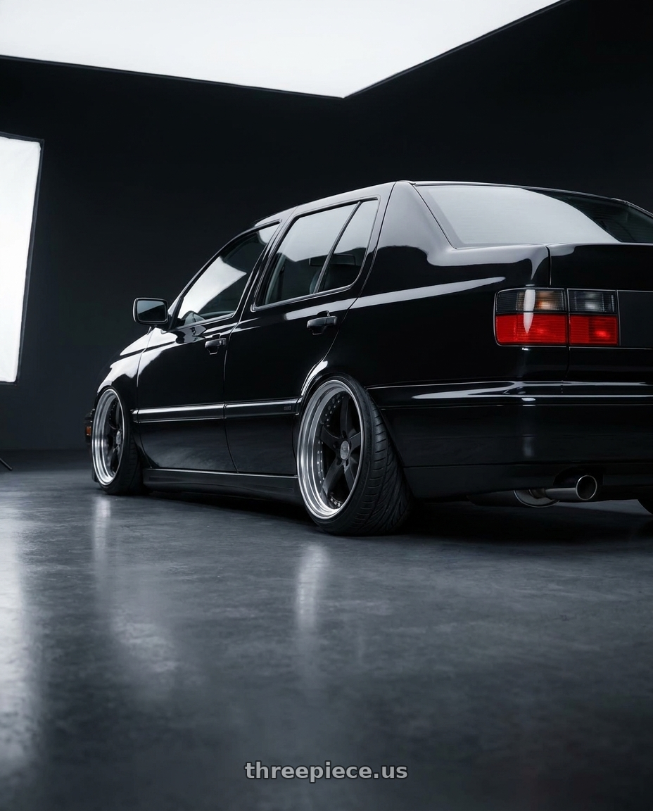 1998 Volkswagen Jetta GLX with Work Equip E05 5x108 19x10.5+10 r disk Black Anodized wheels rear three quarter view extreme stretch tires
