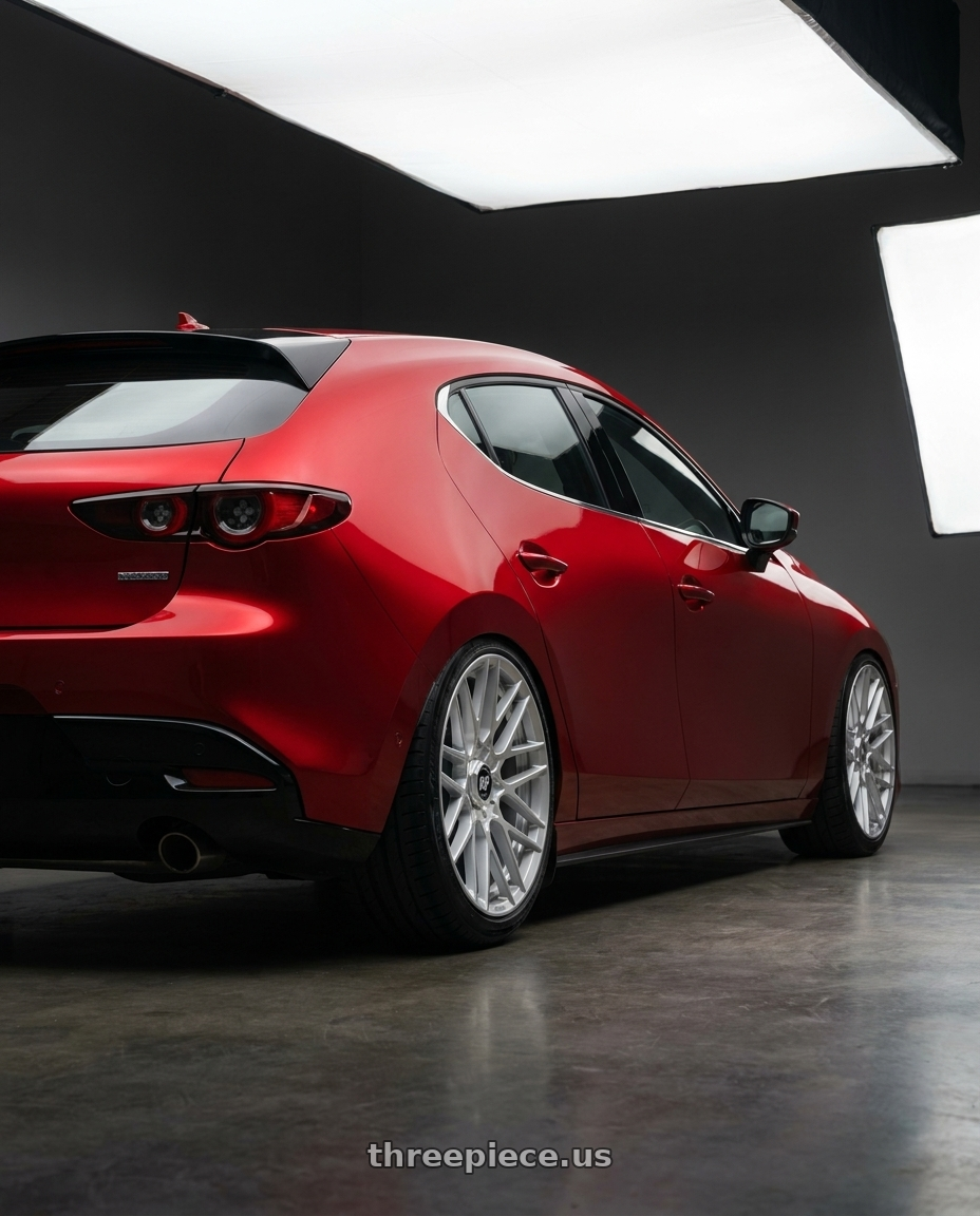 2024 Mazda 3 with Rotiform 1PC R140 RSE 5X114.3/5X120 19X8.5 +35 GLOSS SILVER wheels rear three quarter view slight stretch tires