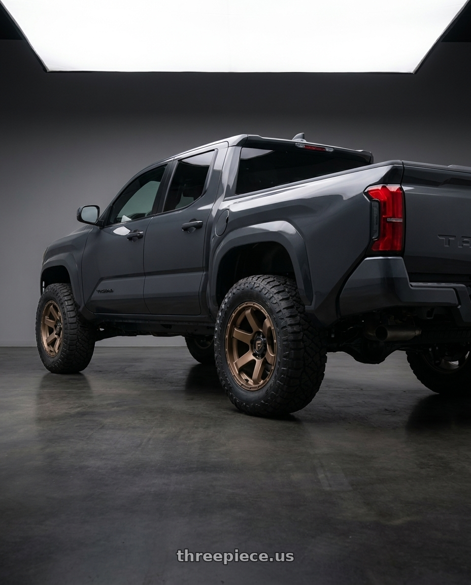 toyota tacoma 4th gen 2024 sr rwd with Fuel 1PC D768 RUSH 6X139.7 20X9 +1 MATTE BRONZE wheels rear three quarter view meaty tires