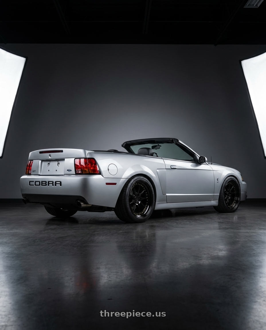 2004 Ford Mustang Svt cobra  with Aodhan DS-X 5x114.3 18x9.5 +22 Gloss Black W /Gold Rivets wheels rear three quarter view square tires