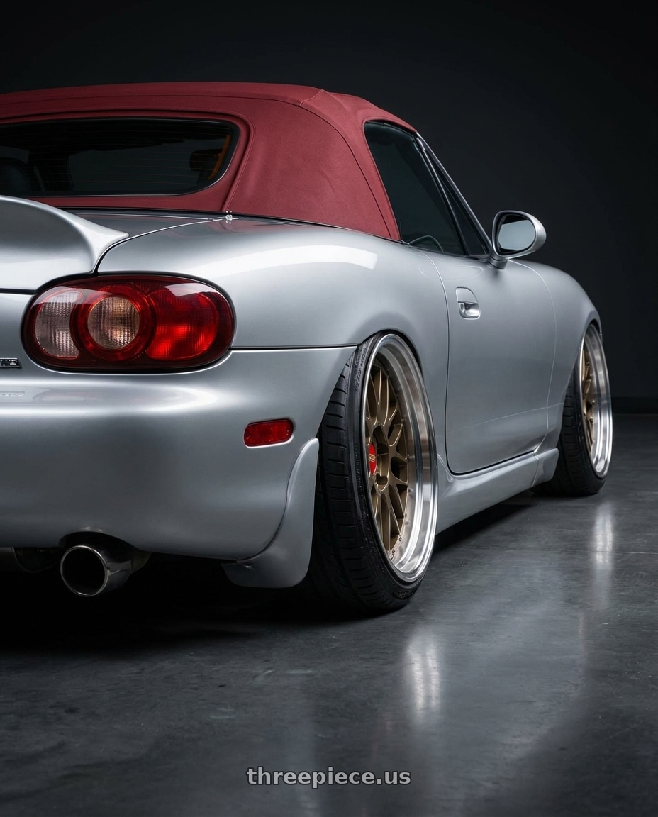 2000 Mazda Miata with BBS LM 5x120 19x9.5+22 Matte Bronze wheels rear three quarter view extreme stretch tires