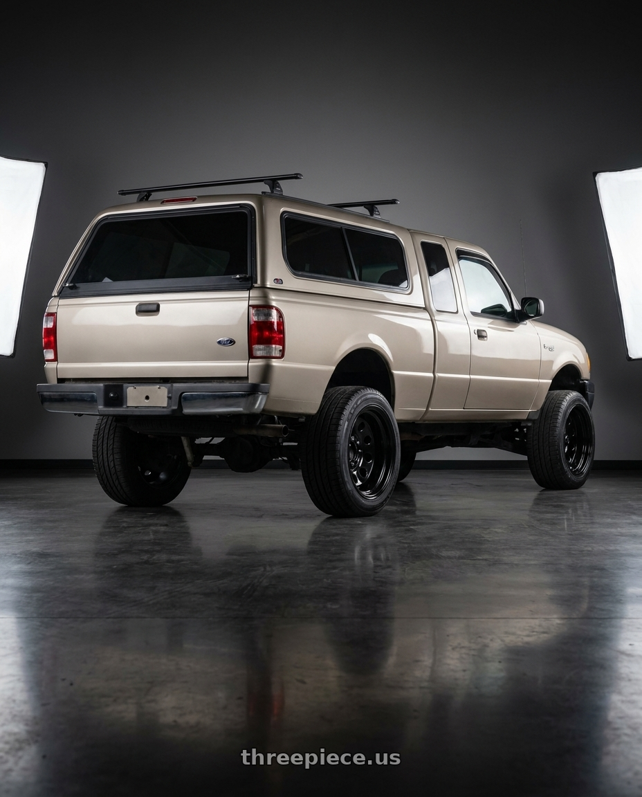 2005 Ford ranger with Vision HD 85H 5x114.3 16x7+0 Gloss Black wheels rear three quarter view extreme stretch tires