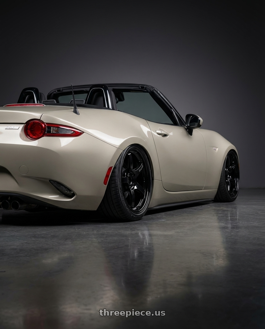 2021 Mazda MX-5 Miata ND with Gram Lights 57CR 5x114.3 17x9+12 Glossy Black wheels rear three quarter view slight stretch tires