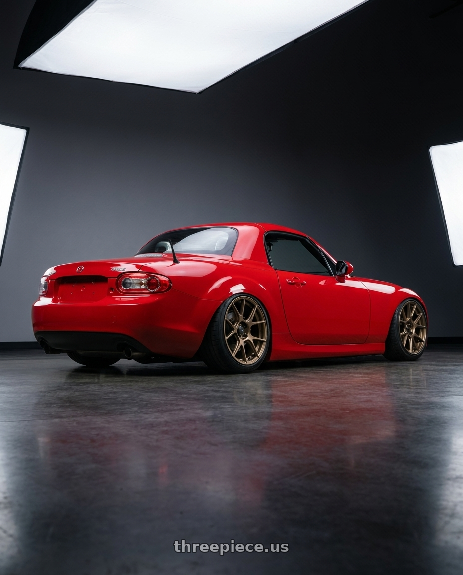 2012 Mazda MX-5 Miata NC with Konig Ampliform 5x114.3 17x8+40 Gloss Bronze wheels rear three quarter view slight stretch tires