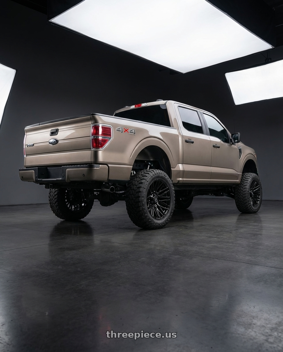 2013 Ford F-150 with Gear Off Road 770B 6X135/6x139.7 22x10 -19 Gloss Black wheels rear three quarter view meaty tires