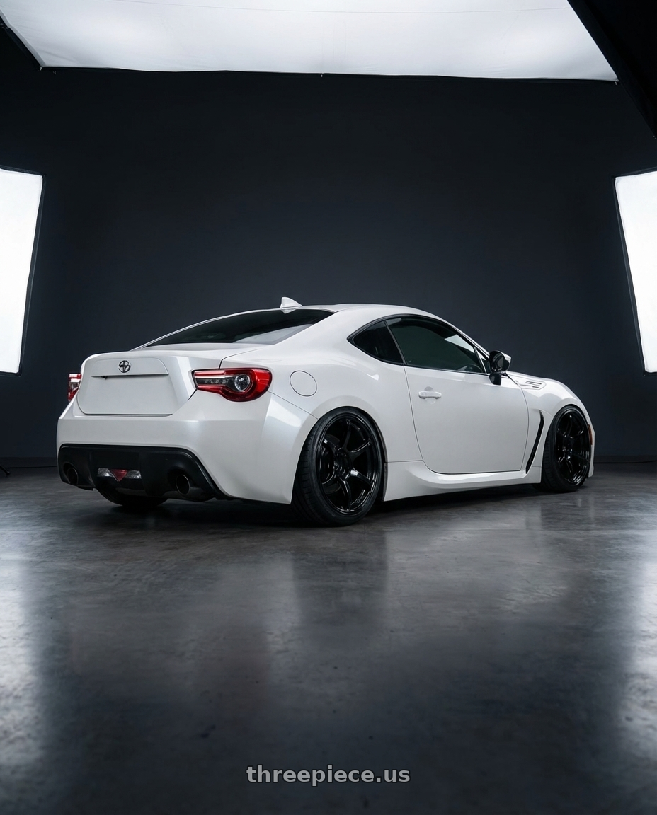 2016 Scion FR-S with Advan RGIII 5x100 18x7.5+50 Gloss Black wheels rear three quarter view slight stretch tires