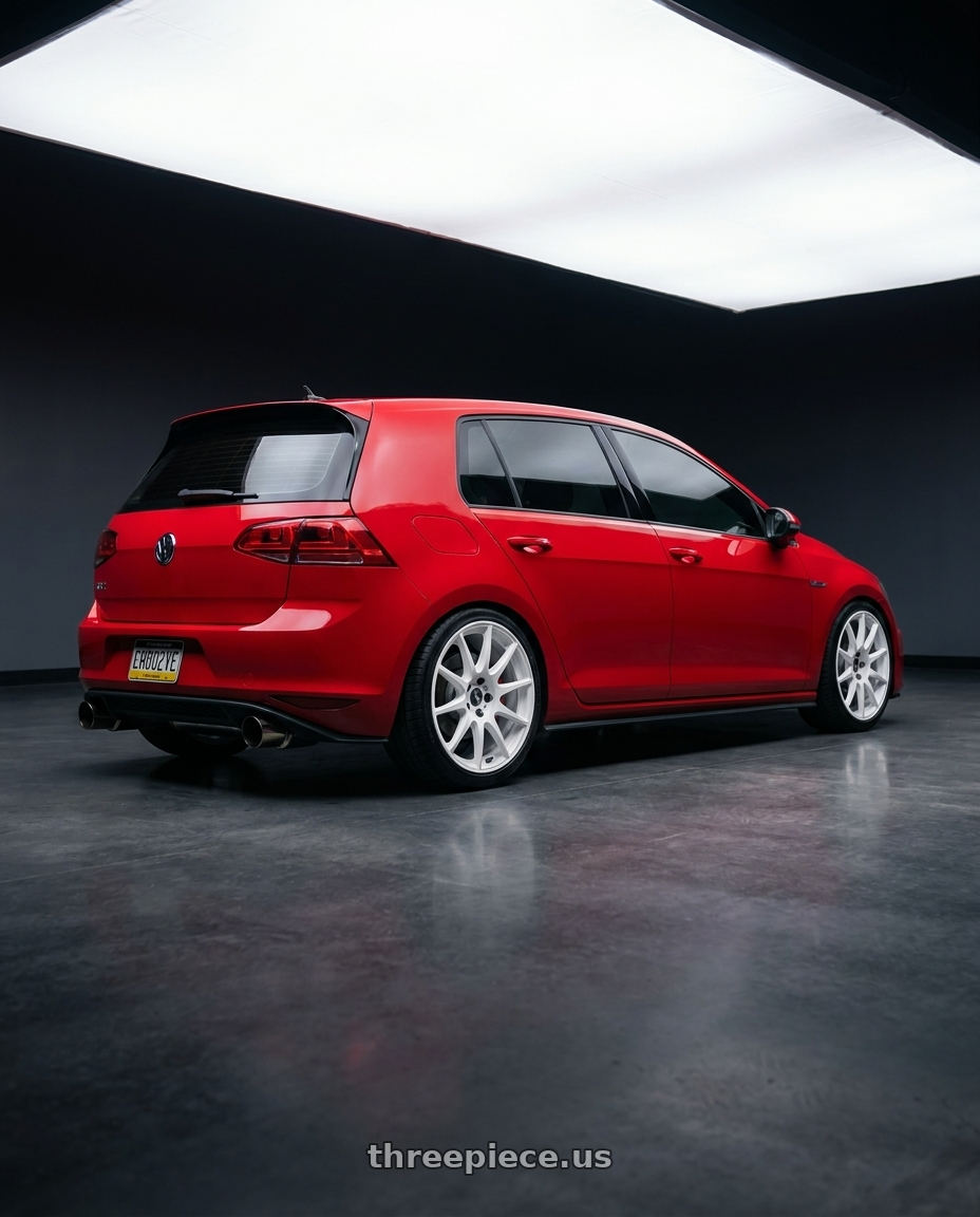 2017 Volkswagen GTI with Work Mco Racing 5x112 18x8.5+40  White wheels rear three quarter view slight stretch tires