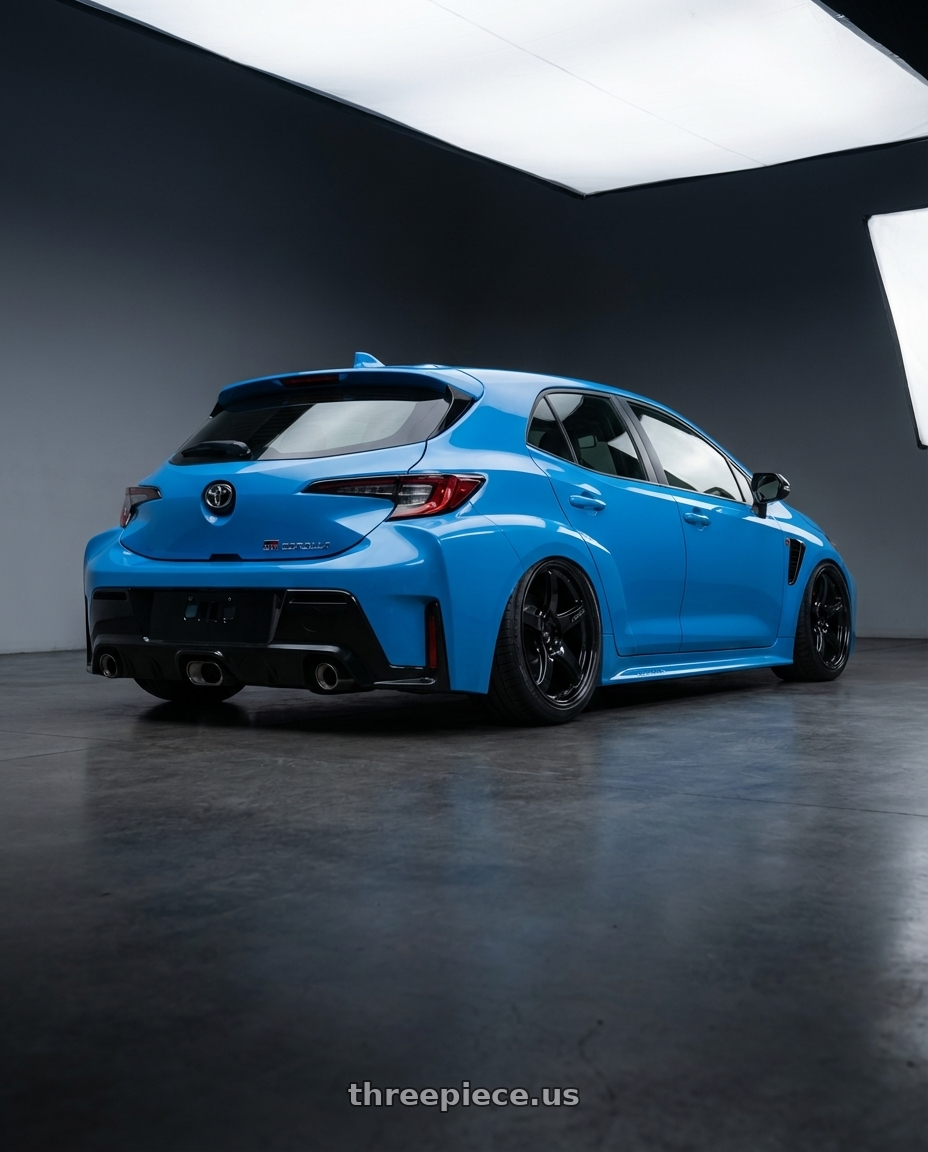 2024 Toyota GR Corolla with Gram Lights 57CR 5x114.3 18x10.5+12 Glossy Black wheels rear three quarter view slight stretch tires