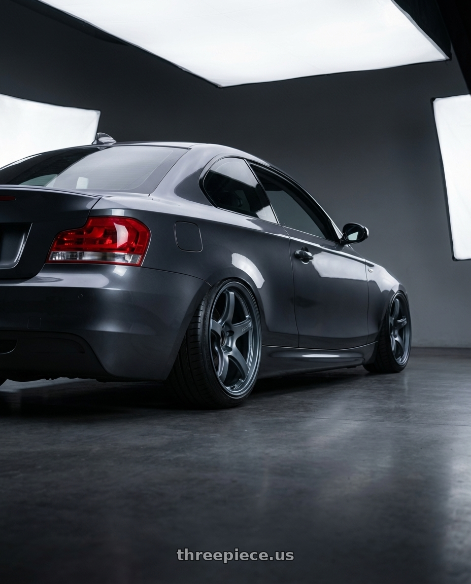 2012 BMW 1 Series E82 with Gram Lights 57CR 5x120 19x9.5+35 Gunblue II wheels rear three quarter view slight stretch tires