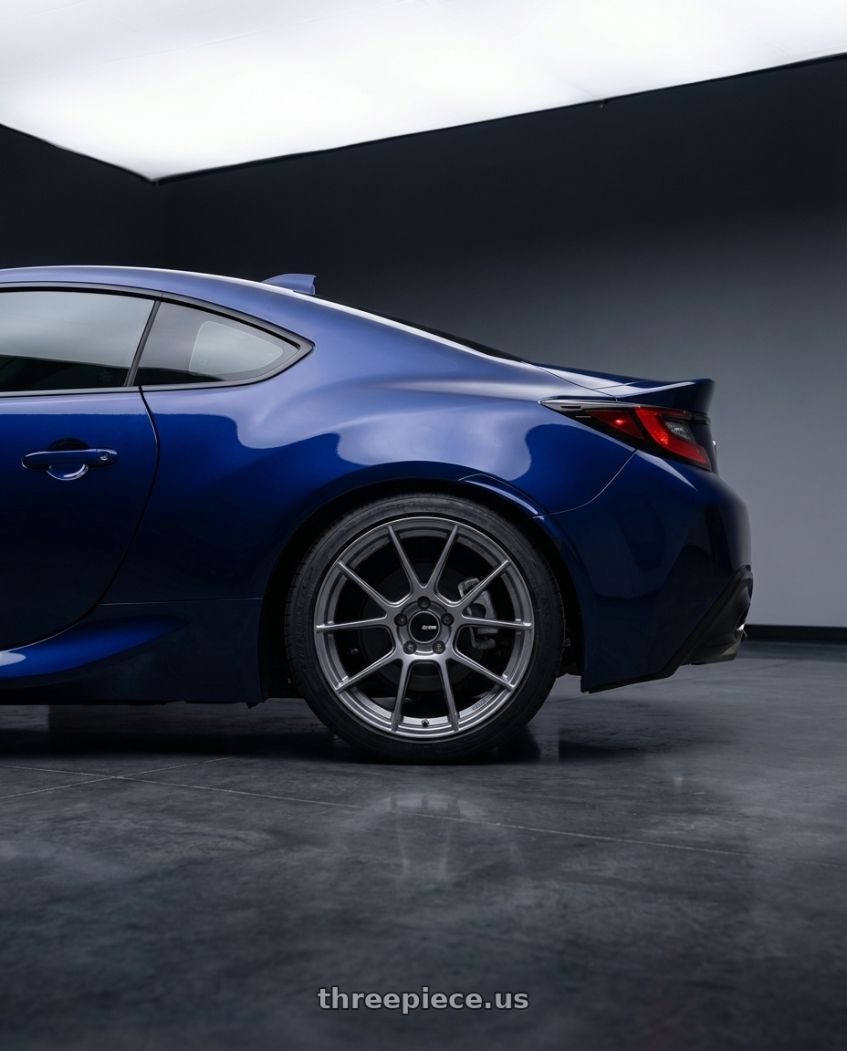 2023 Toyota GR86 with Enkei TS-V 5x100 18x8.5+45 Storm Grey wheels rear three quarter view square tires