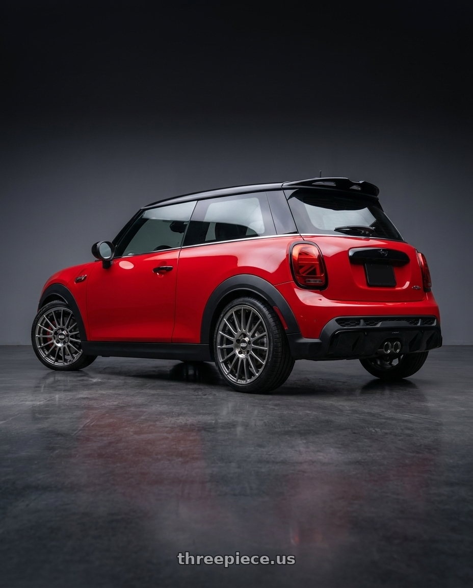 2025 mini jcw red with BBS XR 5x100 18x8.0+45 Gloss Platinum wheels rear three quarter view square tires