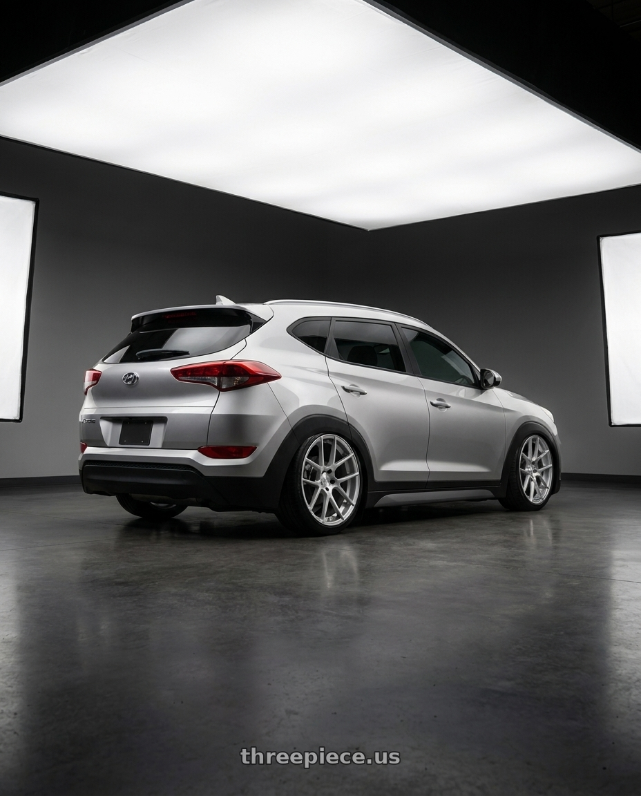 2019 Hyundai tucson with Avant Garde Wheels M510 5X100 19x8.5 +45 Satin Silver wheels rear three quarter view slight stretch tires
