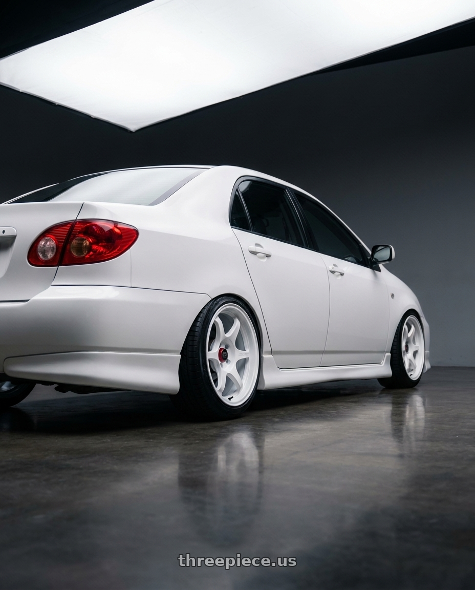 2006 corolla 9gen with Enkei PF06 4x100 15x8+25 White Machined wheels rear three quarter view slight stretch tires