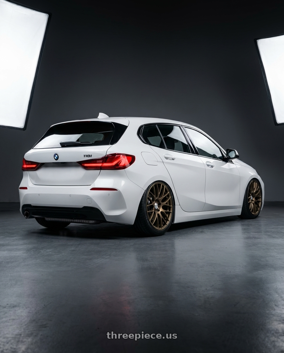 2024 BMW 118i edition sport,white with Work Emotion m8r 4x100 17x7 +38 Matte Bronze wheels rear three quarter view slight stretch tires