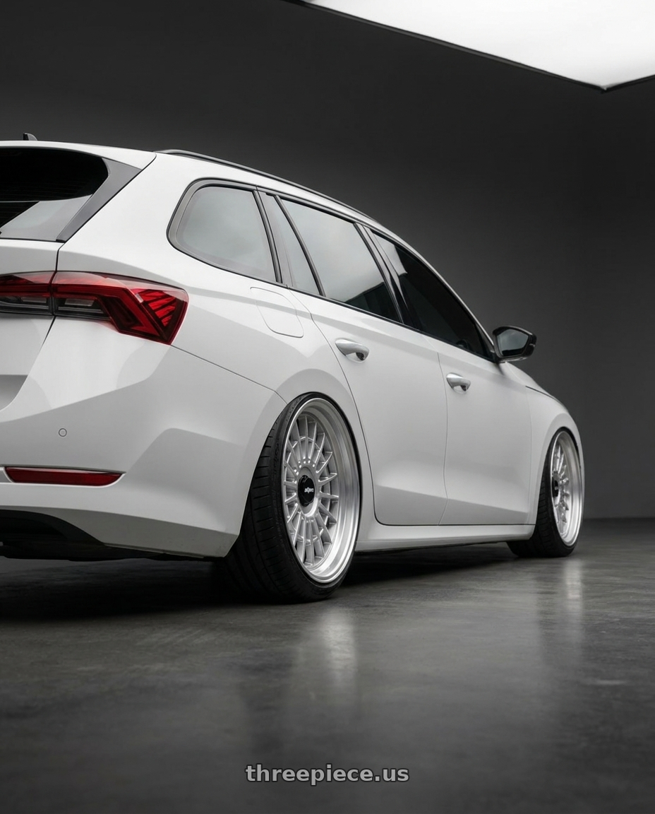 2025 SKODA OCTAVIA with Rotiform 1PC R143 LAS-R 5X112/5X114.3 19X8.5 +35 GLOSS SILVER wheels rear three quarter view extreme stretch tires